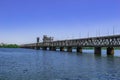 Metal Amur bridge over the Dnieper river in Dnipro Ukraine, side view. Modern monument of engineering art against the background