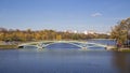 Metal arch bridge across the pond Royalty Free Stock Photo