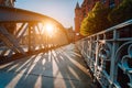 Metal arch bridge in the Speicherstadt of Hamburg with sunburst light during sunset golden hour