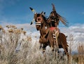 Metal artwork of a native chief sitting astride his horse