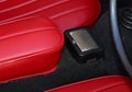 metal ashtray and red leather seats in a vintage car Royalty Free Stock Photo