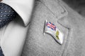 Metal badge with the flag of British Antarctic Territory on a suit lapel