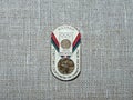 Metal badge with the image of the Olympic medal and the inscription `Soviet athletes at the Olympics, Mexico-1968`