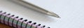 Metal ballpoint pen lying on notepad closeup Royalty Free Stock Photo