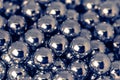 Metal balls arranged side by side to form an organized structure. Macro scale photo with shallow depth of field. Glossy surface Royalty Free Stock Photo