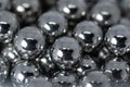 Metal balls arranged side by side to form an organized structure. Macro scale photo with shallow depth of field. Glossy surface Royalty Free Stock Photo