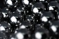 Metal balls arranged side by side to form an organized structure. Macro scale photo with shallow depth of field. Glossy surface Royalty Free Stock Photo