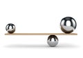 Metal balls balanced on plank Royalty Free Stock Photo