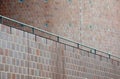 Metal bannister alongside curved facade of modern building Royalty Free Stock Photo