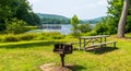 A metal barbeque grill and a picnic table at Chapman State Park in Clarendon, Pennsylvania, USA Royalty Free Stock Photo