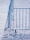 Metal barrier in a stone road - Image with copy space Royalty Free Stock Photo