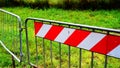 Metal barriers with red decorations for greater evidence, used to mark off interrupted roads Royalty Free Stock Photo