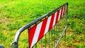 Metal barriers with red decorations for greater evidence, used to mark off interrupted roads Royalty Free Stock Photo