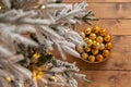 Metal basket with balls, on rough wooden floor. New Year or Christmas background Royalty Free Stock Photo