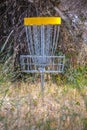 Metal basket for Frisbee Golf on a grassy course Royalty Free Stock Photo
