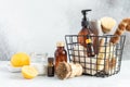 Metal basket with natural cleaning products and tools. Bamboo accessories and natural products for cleaning the kitchen Royalty Free Stock Photo