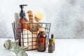 Metal basket with natural cleaning products and tools. Bamboo accessories and natural products for cleaning the kitchen Royalty Free Stock Photo