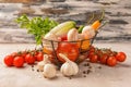 Metal basket with various fresh vegetables on light table Royalty Free Stock Photo