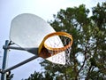 Metal basketball hoop and orange rim in park. Royalty Free Stock Photo