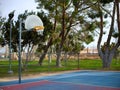 Metal basketball hoop and orange rim in park. Royalty Free Stock Photo