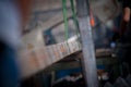 A metal beam raised on slings. Industrial background. Shallow depth of field