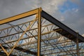 Construction site metal frame building iron beams roof structure