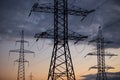 Metal Bearing high voltage power line at sunset Royalty Free Stock Photo