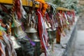 Metal bells hang on chains in a Hindu temple