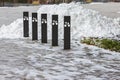 Metal bike racks in the parking lot during the winter