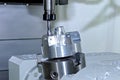 Metal billet is machined on milling machine