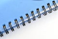 Metal binding in the form of a spring in a school notebook. Royalty Free Stock Photo