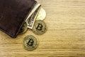Metal bitcoins in brown leather wallet. Bitcoin - modern virtual. 3D illustration