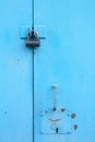 metal blue door with padlock. Old garage gates with keyhole Royalty Free Stock Photo