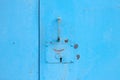 metal blue door with padlock. Old garage gates with keyhole Royalty Free Stock Photo