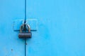 metal blue door with padlock. Old garage gates with keyhole Royalty Free Stock Photo