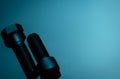 Metal bolts on blue background. Hardware tools. Closeup hex head bolt and socket cap bolt with copy space. Threaded fastener use Royalty Free Stock Photo