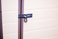 Metal bolts or latches in wooden door close-up