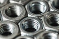 Metal bolts and nuts in a row background Royalty Free Stock Photo