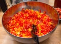 Metal bowl with diced red and yellow bell peppers Royalty Free Stock Photo
