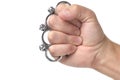 Metal brass knuckles cold steel worn on fist, white background.