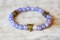 metal brass pendant beed on violet angelite mineral stone bracelet Royalty Free Stock Photo