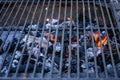 Metal brazier ful of burning coals prepared for baking some meal, meat or vegetables for sale at the marketplace Royalty Free Stock Photo