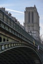 Metal bridge leading to Notre Dame de Paris cathedral