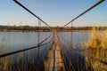 A metal bridge over the reeds. Lake and reeds Royalty Free Stock Photo