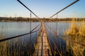 A metal bridge over the reeds. Lake and reeds Royalty Free Stock Photo