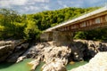 Metal bridge over a river in the mountains view from under the bridge Royalty Free Stock Photo