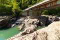 Metal bridge over a river in the mountains view from under the bridge Royalty Free Stock Photo