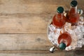 Metal bucket with beer and ice cubes on background, top view. Space for text Royalty Free Stock Photo