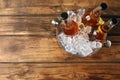 Metal bucket with beer and ice cubes on background, top view. Space for text Royalty Free Stock Photo