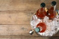 Metal bucket with beer and ice cubes on background, top view. Space for text Royalty Free Stock Photo